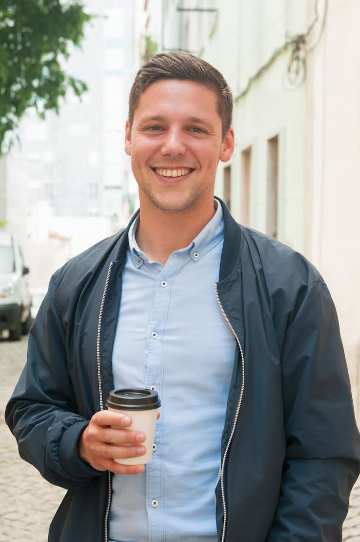 files/cheerful-guy-enjoying-outdoor-coffee-break_1262-20005.avif
